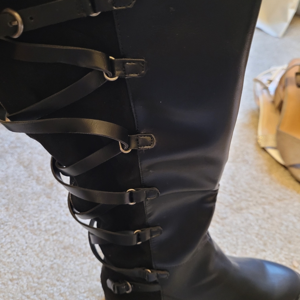 Tall black flat heeled boots
